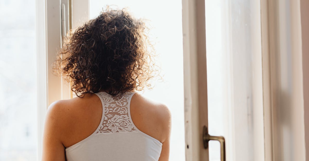 Reset Windows, and now Minecraft will not open - Woman in White Tank Top Standing Near White Wooden Framed Glass Window Reset Windows, and now Minecraft will not open - Woman in White Tank Top Standing Near White Wooden Framed Glass Window