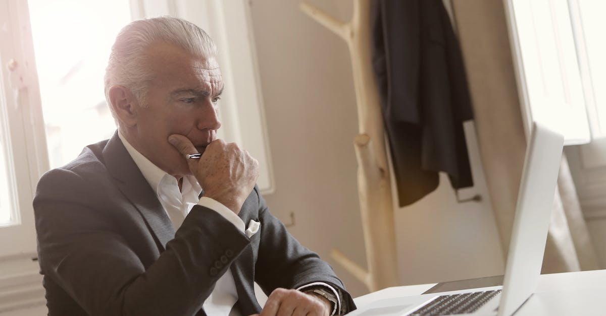 Reseting PSN Password to access old account on PS4? - Man in Black Suit Leaning on White Table Reseting PSN Password to access old account on PS4? - Man in Black Suit Leaning on White Table