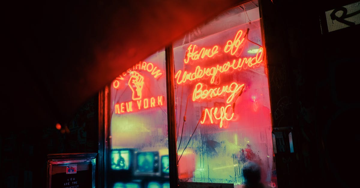 Restart a new game+ in Mass Effect 1 - Exterior of shop with shiny neon inscriptions and vintage TV sets on street in late evening Restart a new game+ in Mass Effect 1 - Exterior of shop with shiny neon inscriptions and vintage TV sets on street in late evening