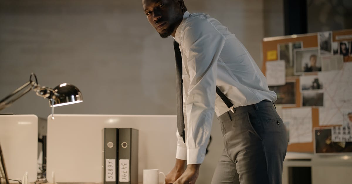 Resuming a suspended Crime Spree costs Continental coins? - Man Wearing White Long Sleeves Standing Near Work Desk Resuming a suspended Crime Spree costs Continental coins? - Man Wearing White Long Sleeves Standing Near Work Desk