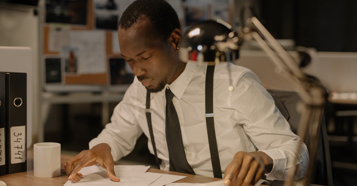 Resuming a suspended Crime Spree costs Continental coins? - Man in White Shirt Looking at the Documents on the Desk Resuming a suspended Crime Spree costs Continental coins? - Man in White Shirt Looking at the Documents on the Desk