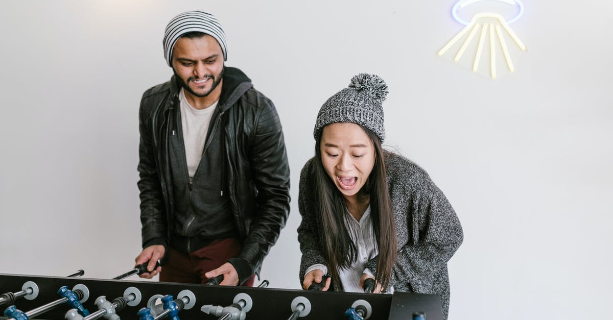 Reusing codes when selling game - Man and Woman Standing Beside Blue and Black Table