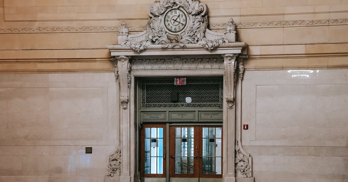 Rewards of Hall of Monuments [duplicate] - Richly decorated door with windows in spacious museum hall