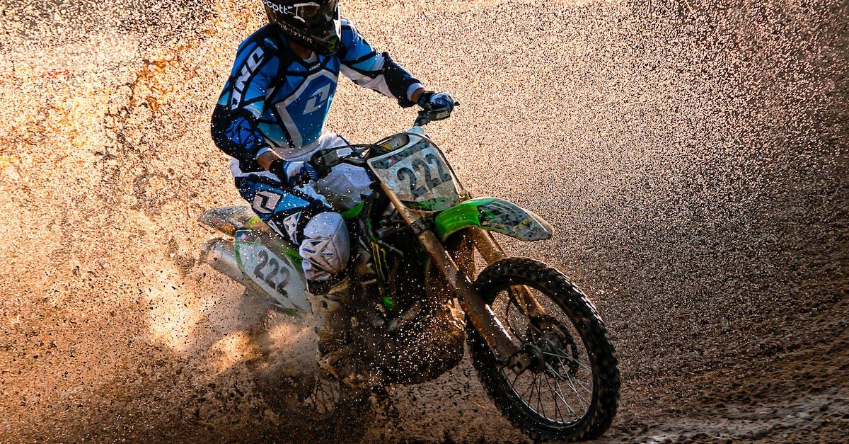 Riding in a Minecart - Man in Black and Red Jacket Riding Green Motocross Dirt Bike Riding in a Minecart - Man in Black and Red Jacket Riding Green Motocross Dirt Bike