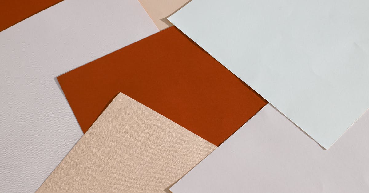 RimWorld - Which objects stack - From above of blank paper sheets of different colors scattered on table as abstract background