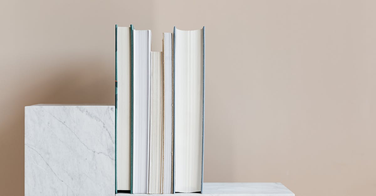 RimWorld - Which objects stack - Geometric modern marble shelf with set of various books against beige background