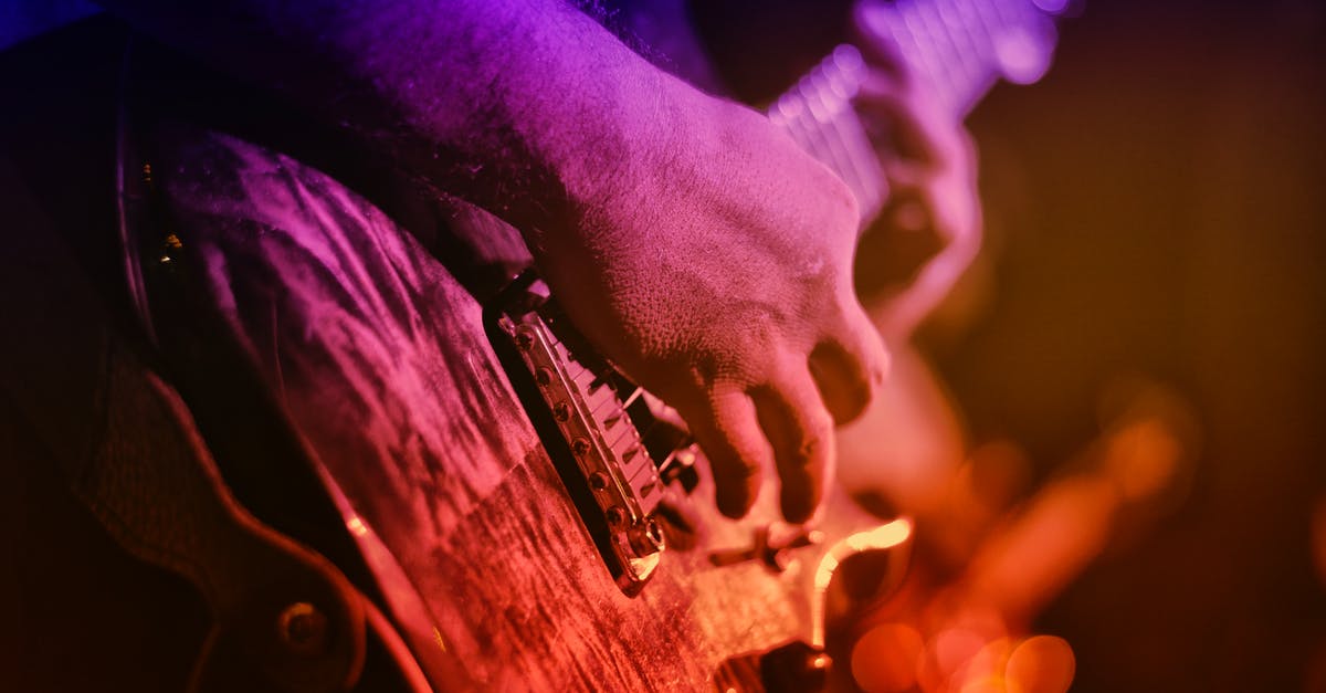 Rock band instrument compatibility - Person Playing String Instruments Rock band instrument compatibility - Person Playing String Instruments