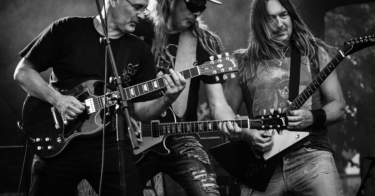 Rock band instrument compatibility - Group of Men Playing Guitar in Concert in Grayscale Photo Rock band instrument compatibility - Group of Men Playing Guitar in Concert in Grayscale Photo