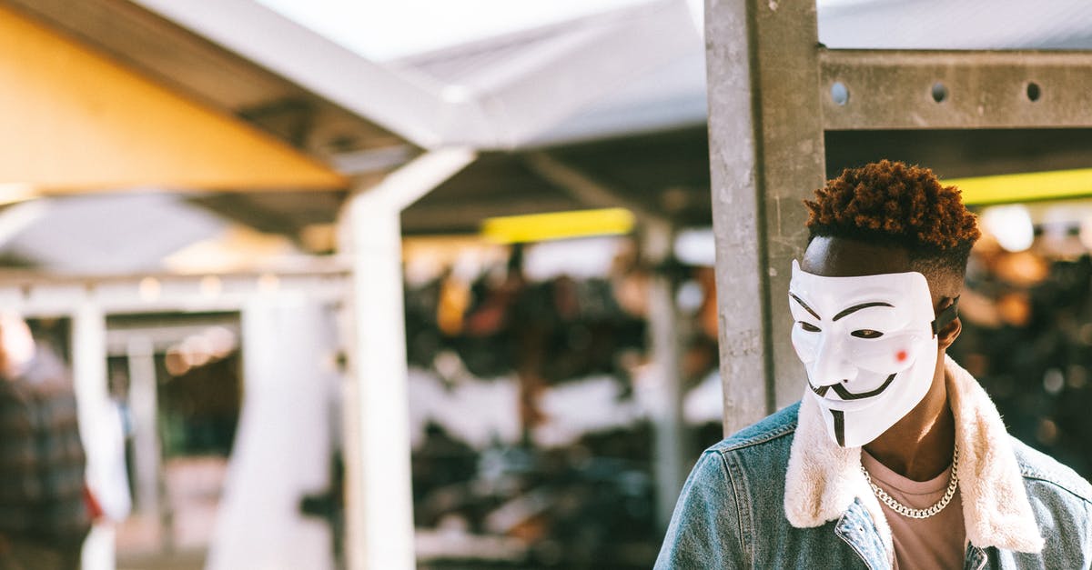 Rose's Answers to Corners (Ultra Street Fighter IV) - Ethnic protester in anonymous mask on city street