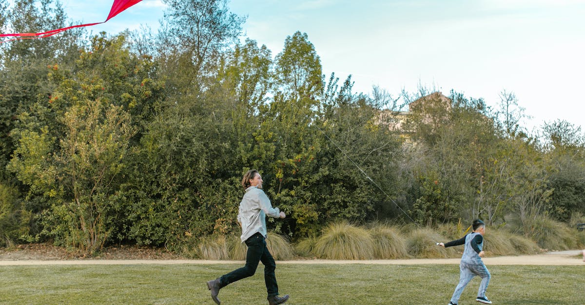 Running out of time in attacks - Man in Gray Long Sleeve Shirt and Black Pants Holding Multi Colored Umbrella Running out of time in attacks - Man in Gray Long Sleeve Shirt and Black Pants Holding Multi Colored Umbrella