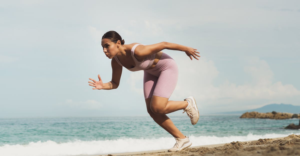 Running out of Time in War while Attacking - Woman Running on Beach Running out of Time in War while Attacking - Woman Running on Beach