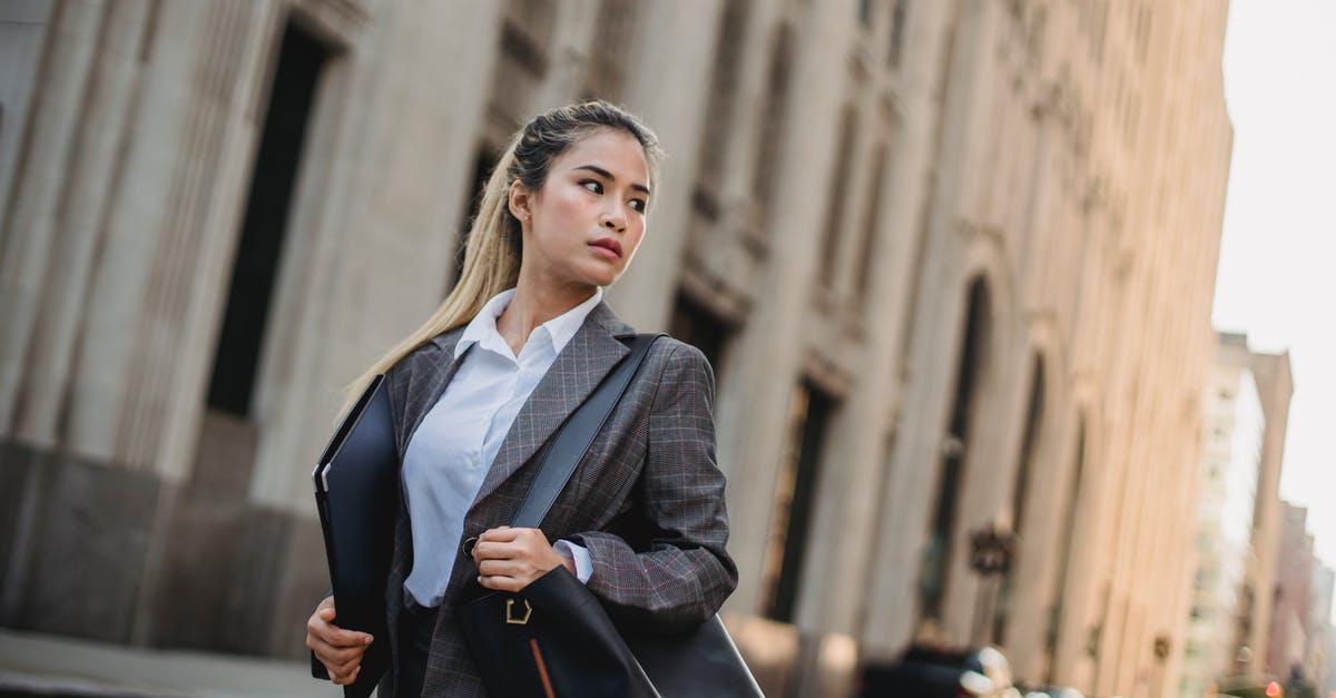 Rushing TH in C.O.C [duplicate] - Woman in Black Blazer Standing Near Building