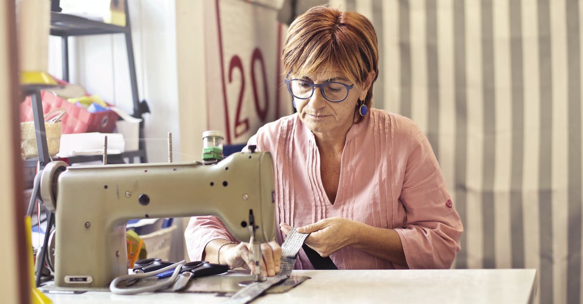 Same account on 2 machines. Can't see the chacters created on other machine - Photo of Woman Using Sewing Machine