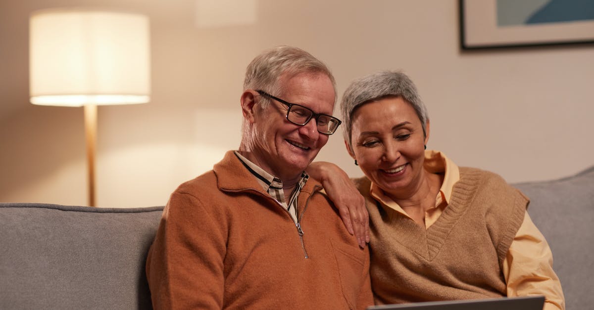 Saves replace newer saves with older ones when Online after being in Offline Mode? - Man and Woman Sitting on Sofa While Looking at a Laptop Saves replace newer saves with older ones when Online after being in Offline Mode? - Man and Woman Sitting on Sofa While Looking at a Laptop