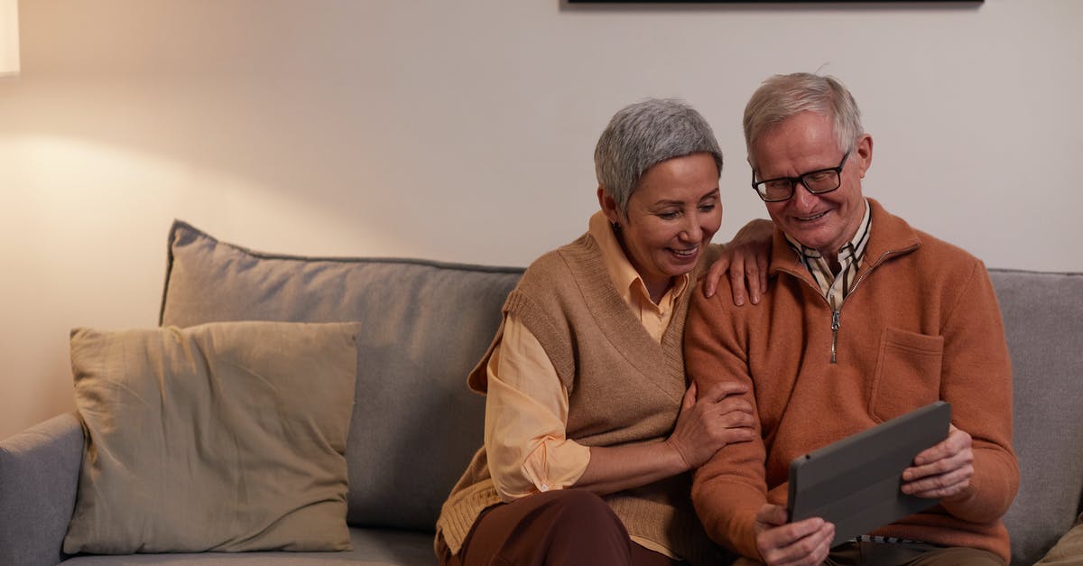 Saves replace newer saves with older ones when Online after being in Offline Mode? - Man and Woman Sitting on Sofa While Looking at a Tablet Computer Saves replace newer saves with older ones when Online after being in Offline Mode? - Man and Woman Sitting on Sofa While Looking at a Tablet Computer