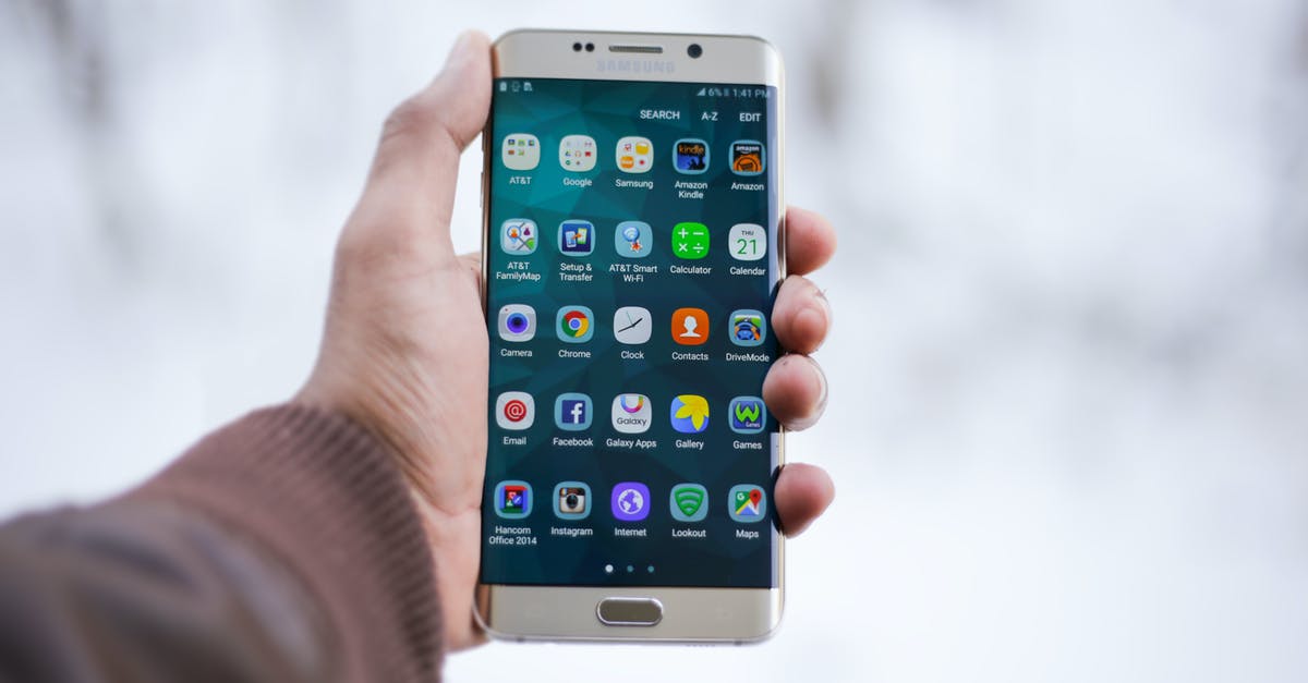 Screen is cut on edges - Person Holding Silver Android Smartphone