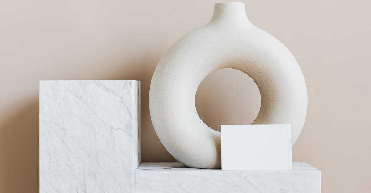 SD Card has valid images but wont load in Art Academy Ateiler/Home Studio - Composition of creative white ceramic vase in ring shape with empty postcard placed on white marble shelf against beige wall as home decoration elements or art objects SD Card has valid images but wont load in Art Academy Ateiler/Home Studio - Composition of creative white ceramic vase in ring shape with empty postcard placed on white marble shelf against beige wall as home decoration elements or art objects