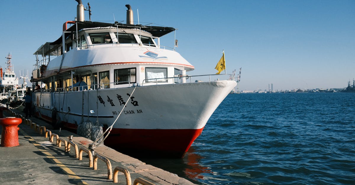 Seaport and ferry dock and airport - A Boat Docked Near the Concrete Pier