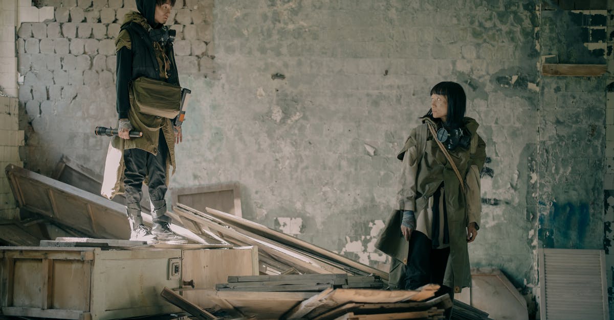 Searching for mod to Diablo II Lord Of Destruction - Woman in Black Jacket and Blue Denim Jeans Standing Beside Brown Wooden Table