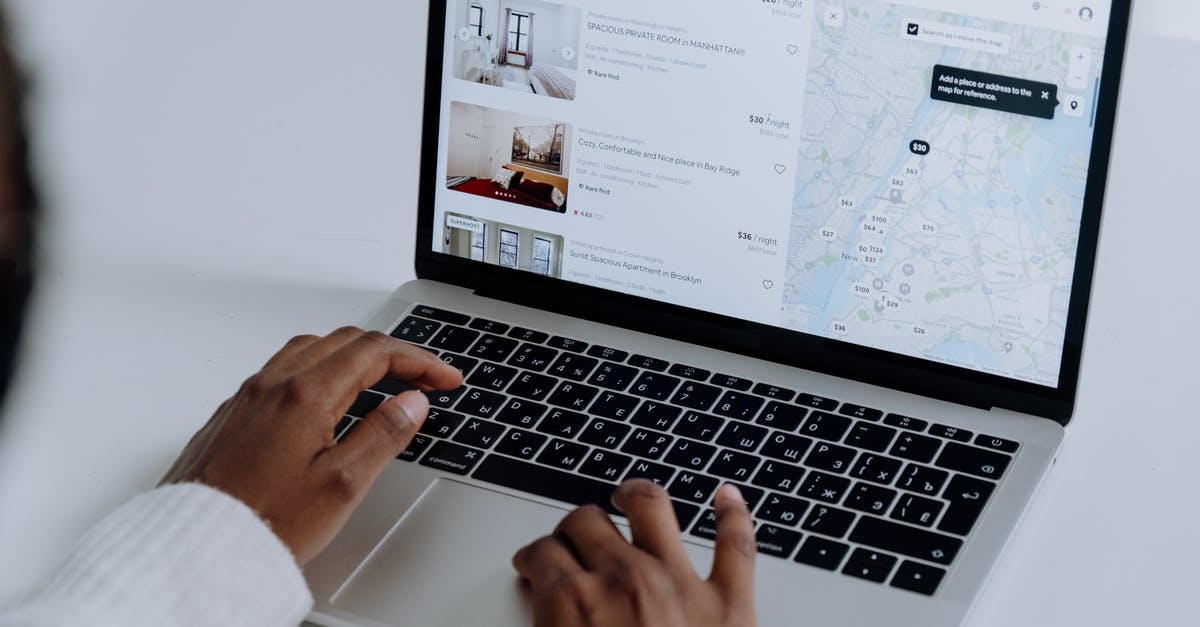 Searching for specific metadata in maps - Person Using Macbook Pro on White Table Searching for specific metadata in maps - Person Using Macbook Pro on White Table