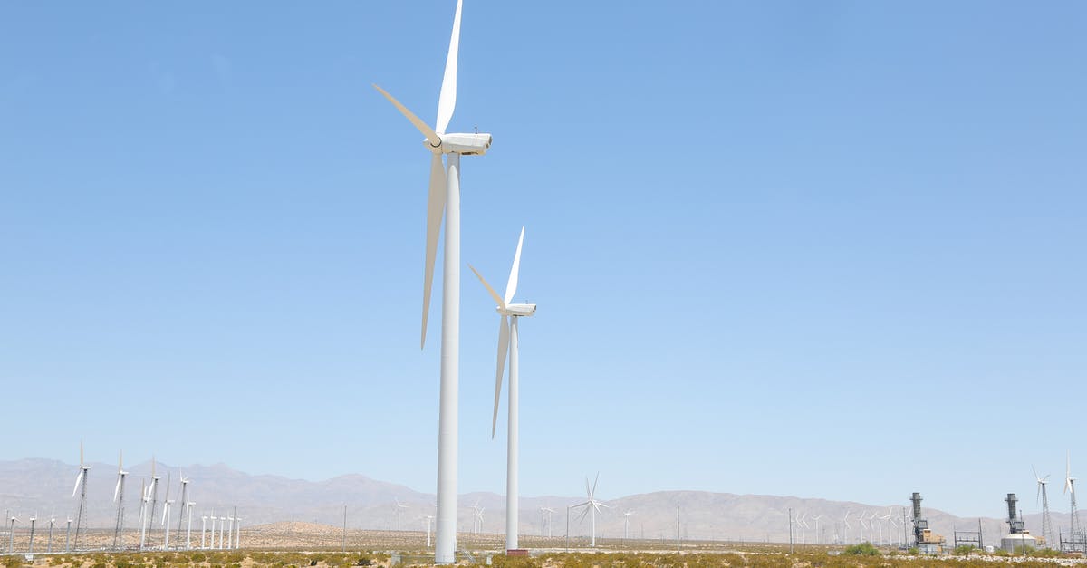 Season Ranking System XP Requirements - Tall wind energy converters with long steel towers and long thin rotor blades in meadow covered with tiny green bushes under light blue cloudless sky Season Ranking System XP Requirements - Tall wind energy converters with long steel towers and long thin rotor blades in meadow covered with tiny green bushes under light blue cloudless sky