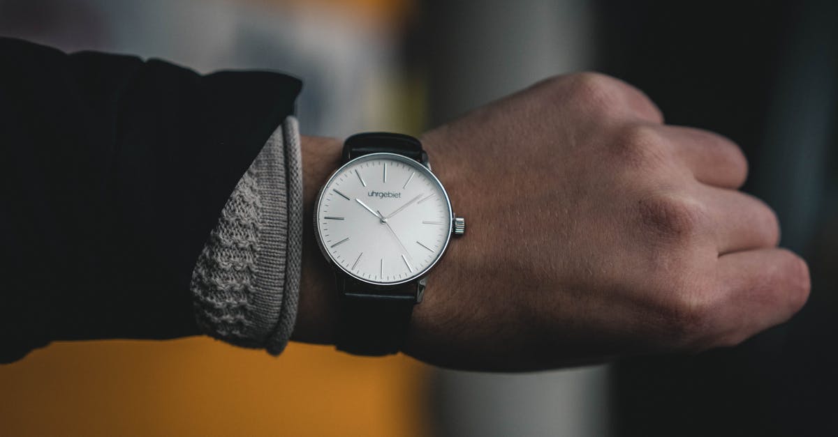 Seconds to ticks conversion - Person Wearing Round White Analog Watch at 10:09 Seconds to ticks conversion - Person Wearing Round White Analog Watch at 10:09