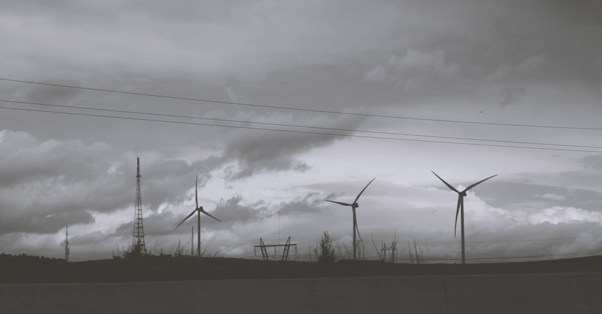 See current rotation without playing - Three Wind Mills Under Cloudy Sky See current rotation without playing - Three Wind Mills Under Cloudy Sky