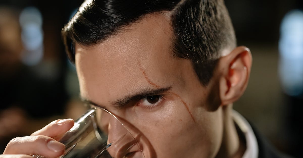 Seifer's Scar And Related Plot Points? [closed] - Close-Up Photo of Man Drinking from Glass of Whiskey