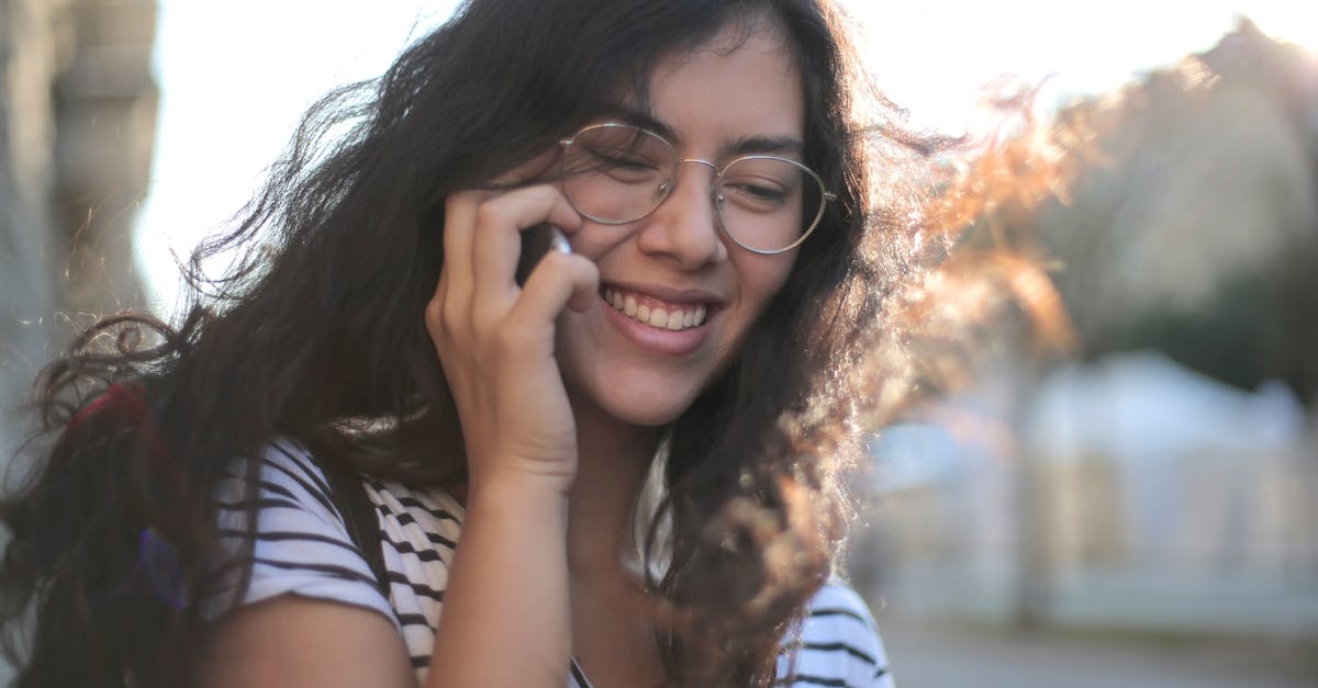 Select phenotypes to use for empires - Cheerful young woman making phone call on street