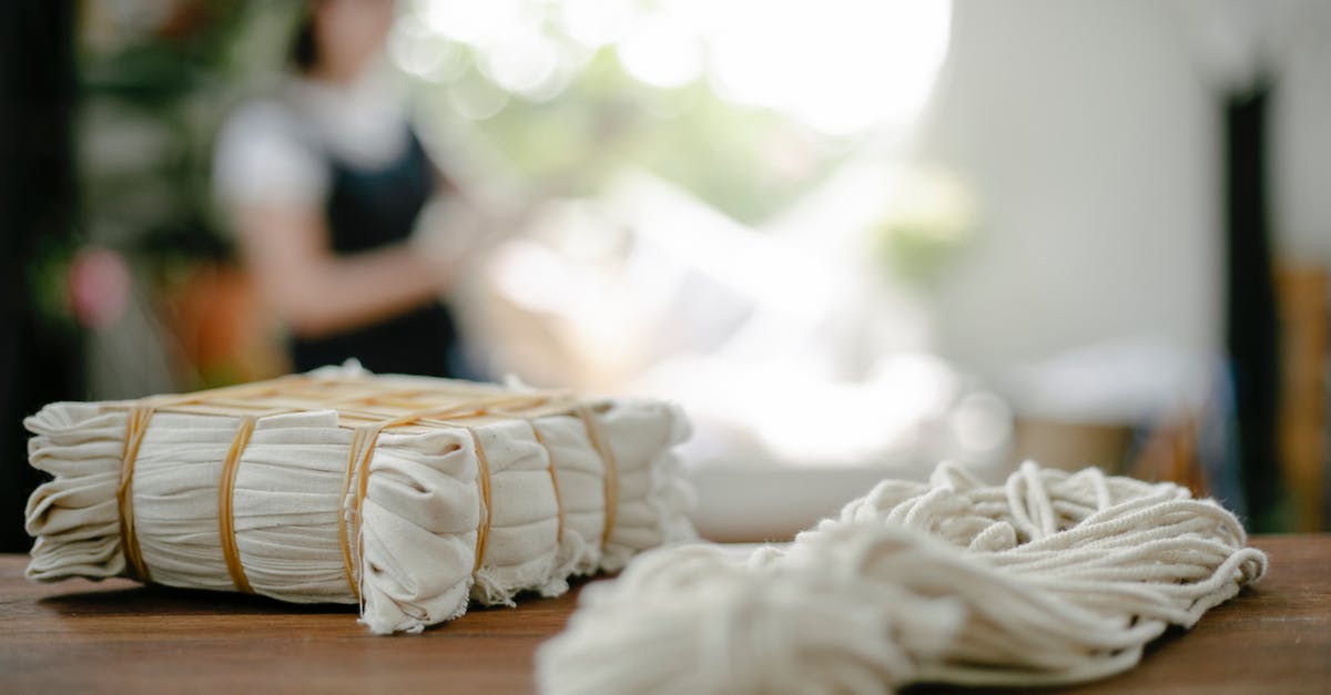 Set up a new hard drive for Playstation 3? - Pile of tied natural fabric and white yarn on table