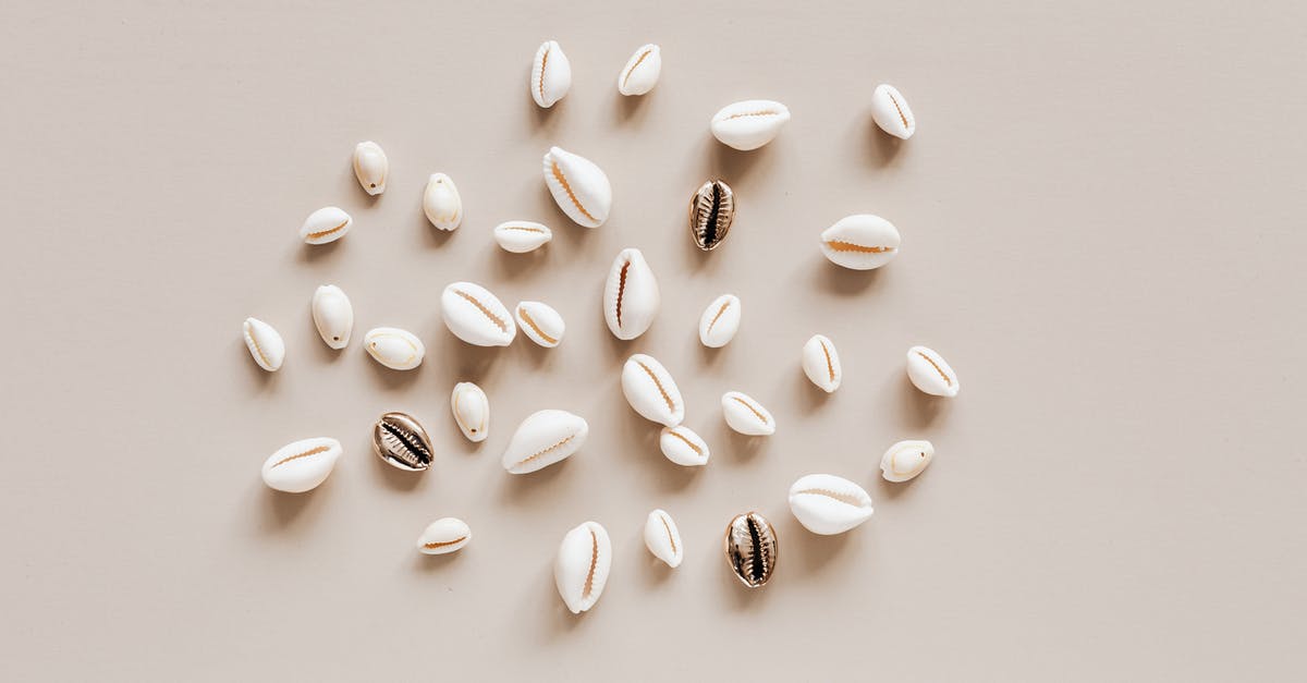 Shadow achievement that is randomly obtained - Composition of different conchs on beige table