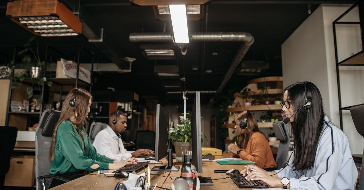 Share save files between computers - People Sitting on the Table with Computers
