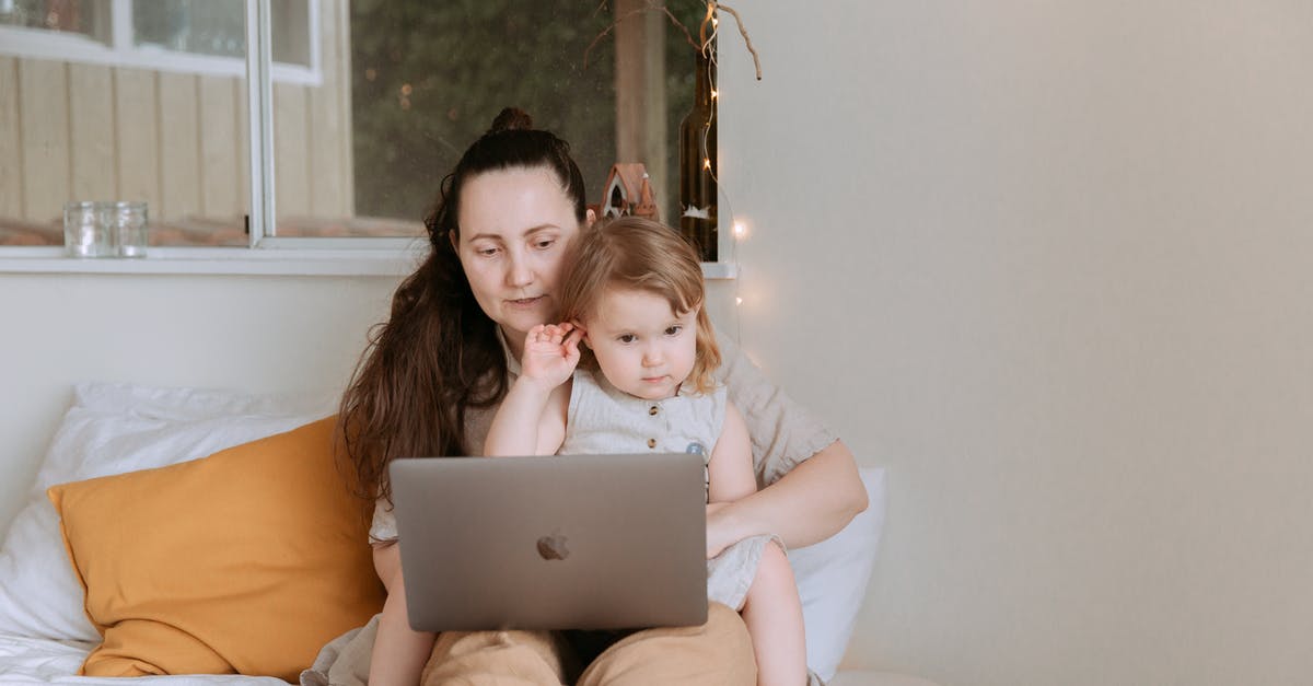 Share Steam games bought on parent account and computer to child account and computer - Adult woman with preschool girl in dress spending time together on bed using laptop Share Steam games bought on parent account and computer to child account and computer - Adult woman with preschool girl in dress spending time together on bed using laptop