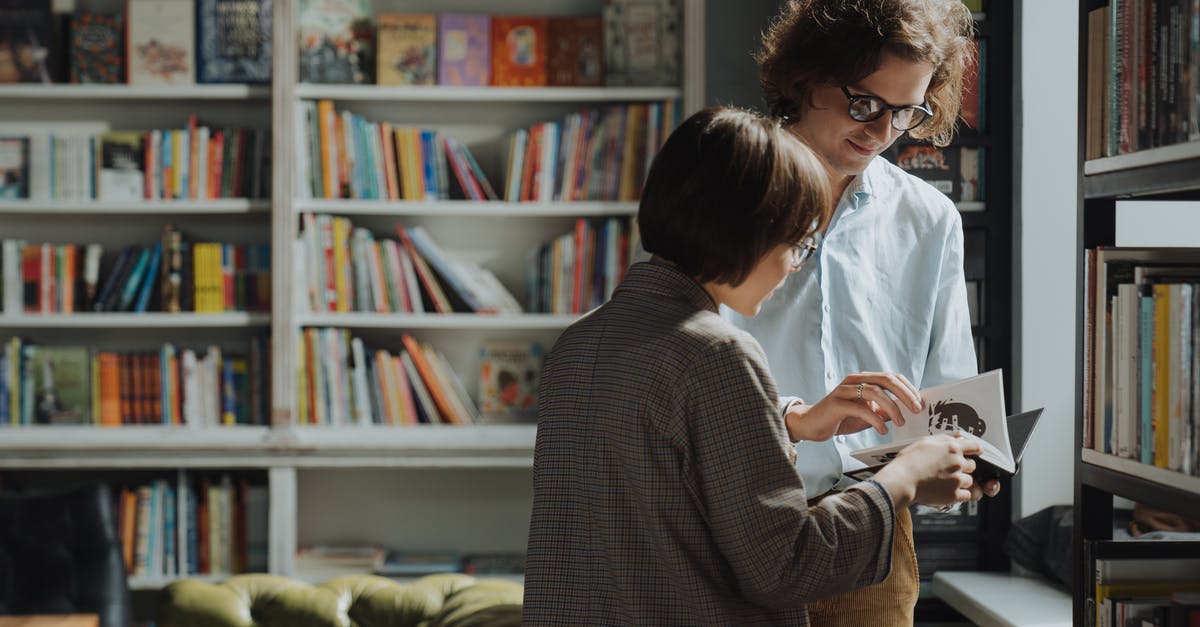 Sharing Ownership of Minecraft Education Edition - Man in Gray and Black Pinstripe Dress Shirt Sitting Beside Woman in White Long Sleeve Shirt Sharing Ownership of Minecraft Education Edition - Man in Gray and Black Pinstripe Dress Shirt Sitting Beside Woman in White Long Sleeve Shirt