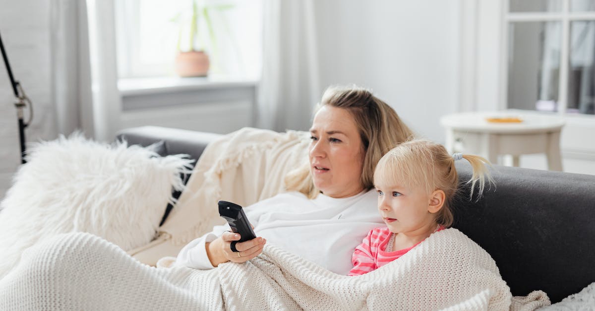 Sharing the same controller without constantly USB syncing? - A Girl Sitting Beside Her Mother