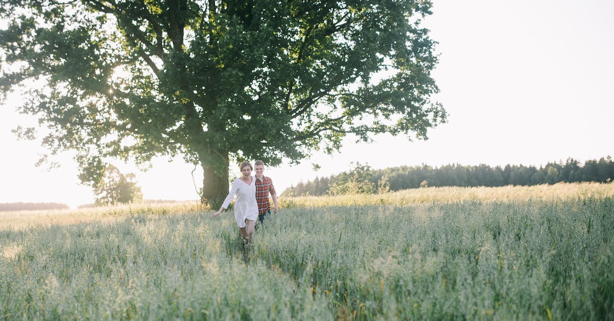 Shift slows me down instead of running - Man and Woman Walking on Green Grass Field Shift slows me down instead of running - Man and Woman Walking on Green Grass Field
