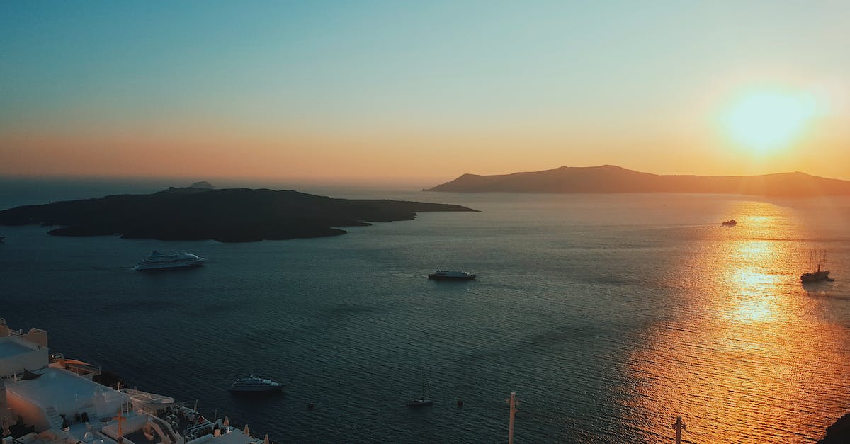 Ships per colony - Aerial Photography of Ferries on the Ocean during Sunrise Ships per colony - Aerial Photography of Ferries on the Ocean during Sunrise