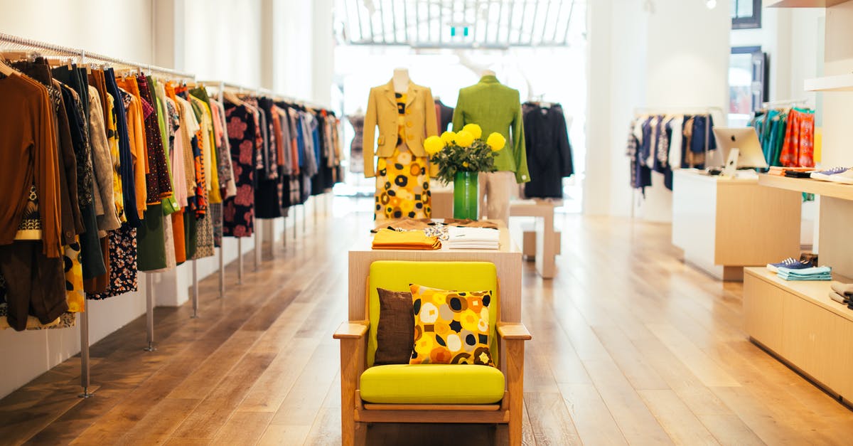 Shops in Planet coaster - How do shop extras effect the shop's appeal and the consuming peep? - Interior of modern fashion store with stylish colorful clothes handing on rack in daytime Shops in Planet coaster - How do shop extras effect the shop's appeal and the consuming peep? - Interior of modern fashion store with stylish colorful clothes handing on rack in daytime