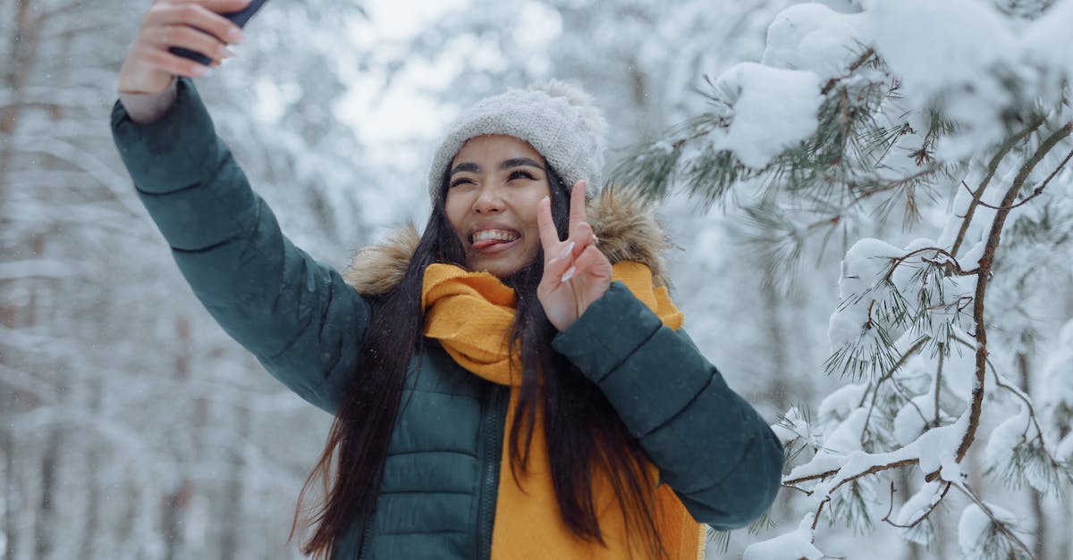 Should a Freezing Trap return a stolen minion to my hand? - Woman in Winter Clothes Taking Selfie