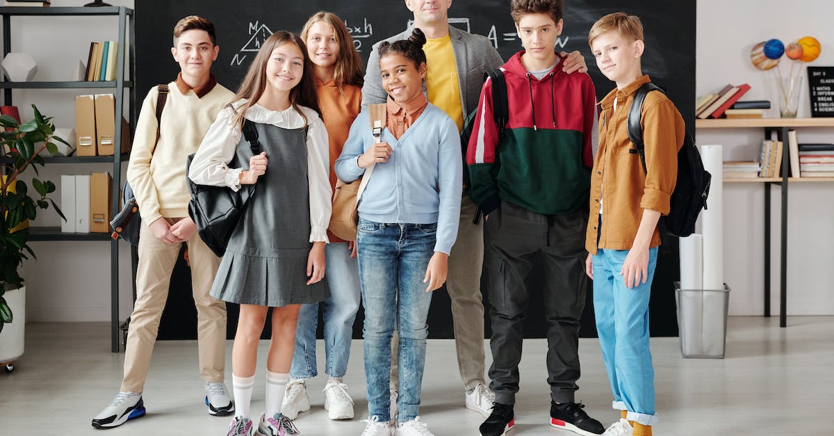 Should a teacher be educated? - Group of People Standing on Gray Concrete Floor Should a teacher be educated? - Group of People Standing on Gray Concrete Floor