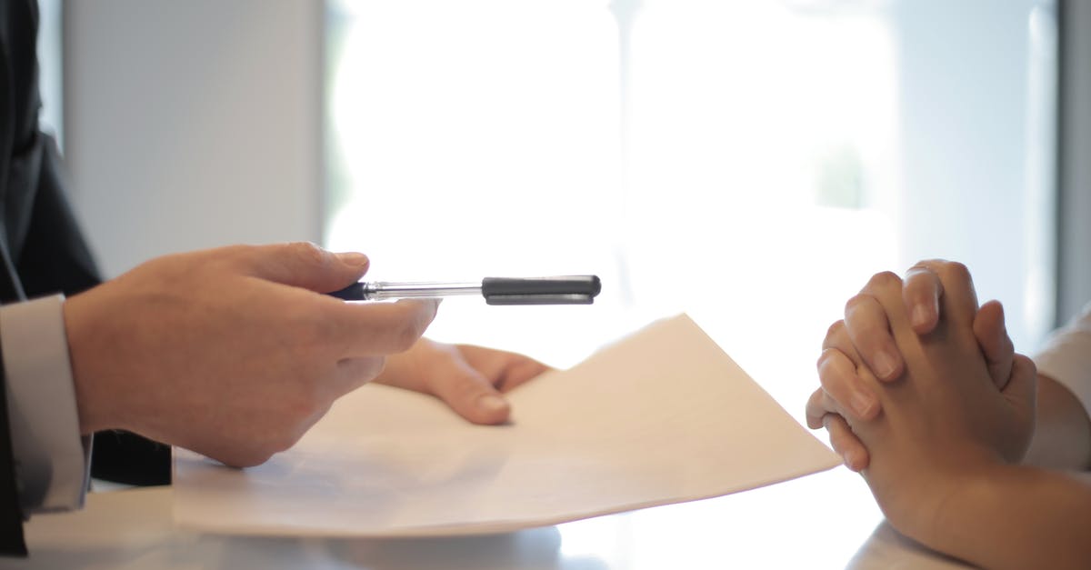 Should I accept an enemy retreat? - Crop businessman giving contract to woman to sign Should I accept an enemy retreat? - Crop businessman giving contract to woman to sign