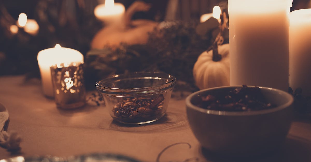 Should I be setting up an arena to defeat the Pumpkin Moon? - Pillar Candles Beside Bowls on Table