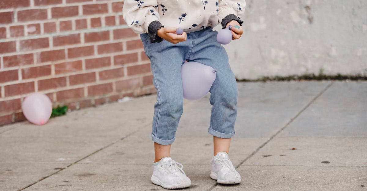 Should I have a different crew for bombers than for fighters? - Crop anonymous kid in trendy wear playing with balloon between legs while standing on tiled pavement in town Should I have a different crew for bombers than for fighters? - Crop anonymous kid in trendy wear playing with balloon between legs while standing on tiled pavement in town