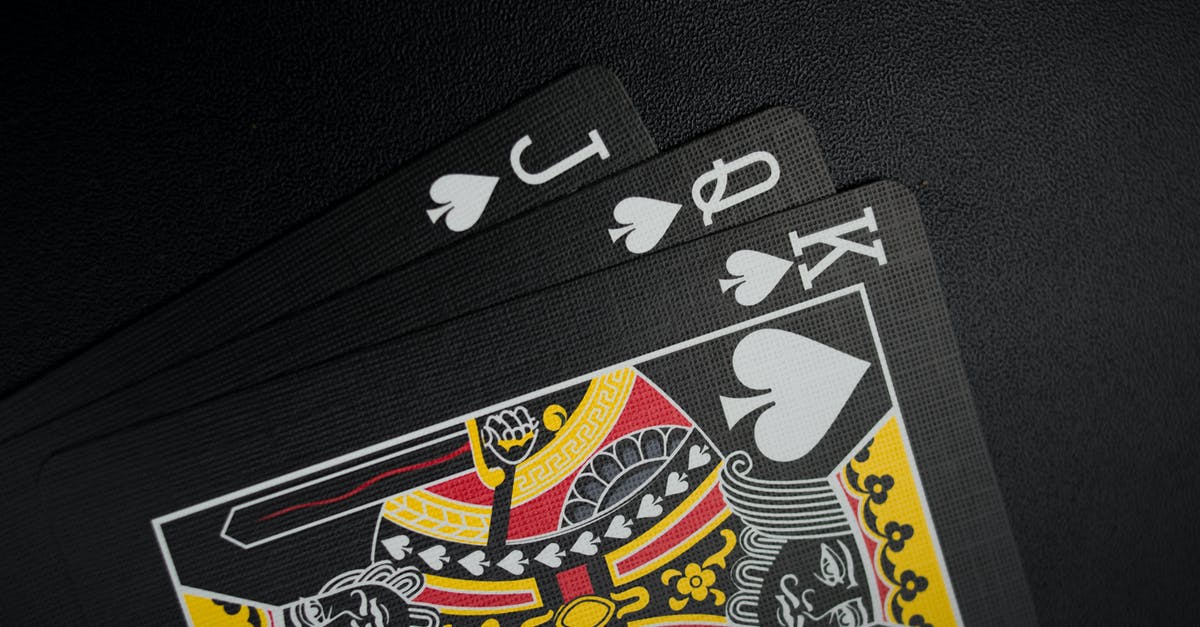 Should I keep giving cards when I'm King 13? - Black Playing Cards on Black Background Should I keep giving cards when I'm King 13? - Black Playing Cards on Black Background