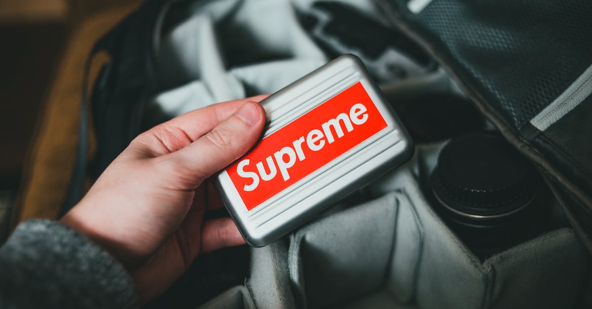 Should I keep hold of 'useless' items? [duplicate] - From above of crop anonymous male holding modern portable external hard drive with red sticker above back with camera lens
