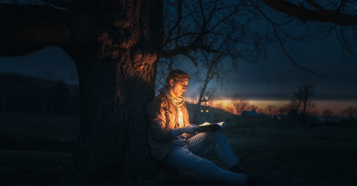 Should I save books in my inventory in Neverwinter Nights? - Man Sitting Under A Tree Reading A Book during Night Time Should I save books in my inventory in Neverwinter Nights? - Man Sitting Under A Tree Reading A Book during Night Time