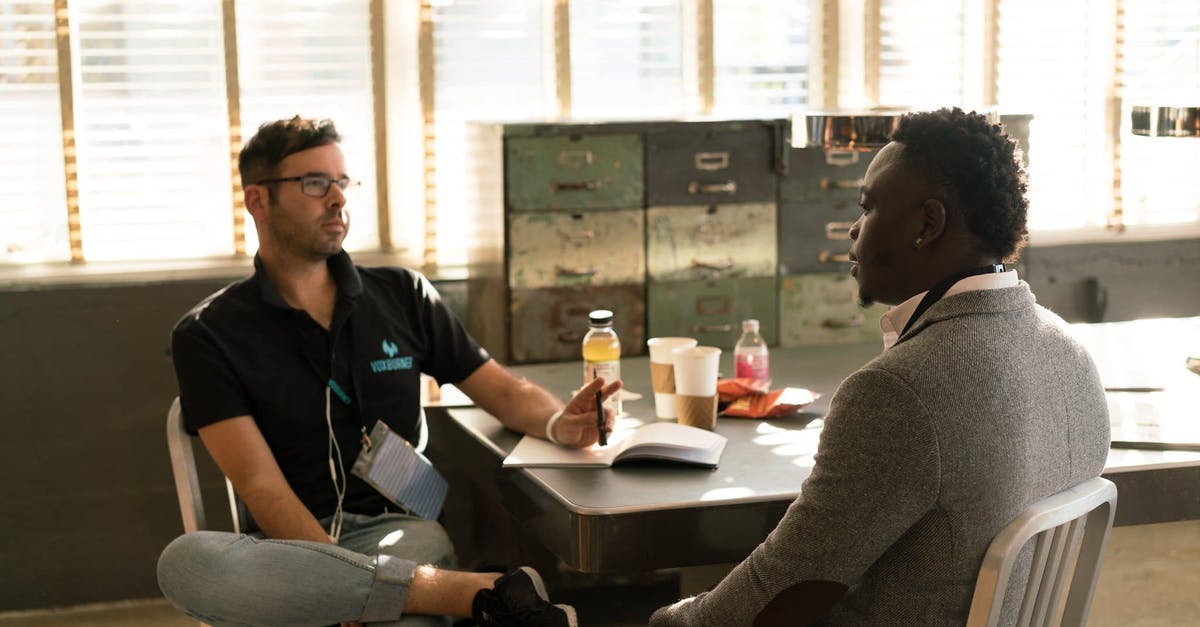 Should one use first or third person terminology when discussing one's character? [closed] - Man Wearing Black Polo Shirt and Gray Pants Sitting on White Chair