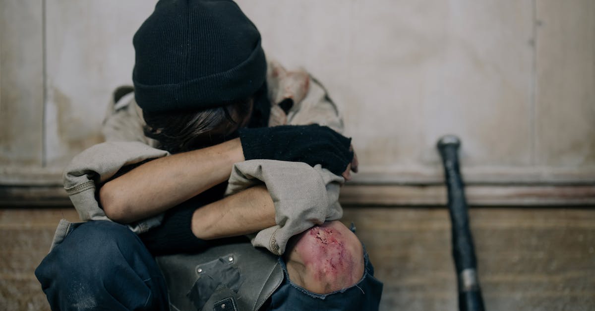 silence a buffed and damaged minion will not affect the buff on its hp? - Man in Black T-shirt and Black Cap Sitting on Brown Wooden Bench