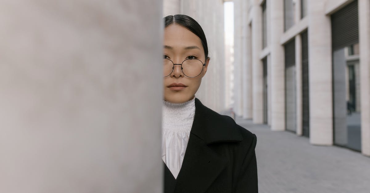 Silverfish stone/egg placement - Woman in Black Blazer Smiling Silverfish stone/egg placement - Woman in Black Blazer Smiling