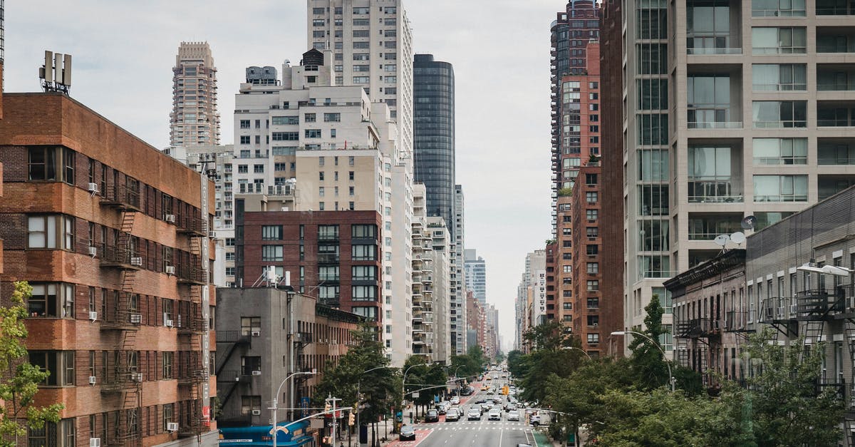 simcity cannot remove road after lizard destroy expo center - New Your City street with vast busy road between contemporary typical buildings on clear day
